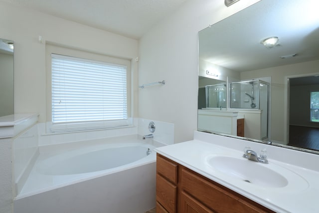 30515 Red Bluff Cir, Magnolia, TX 77355 - full bathroom featuring vanity, a bath, and a shower stall