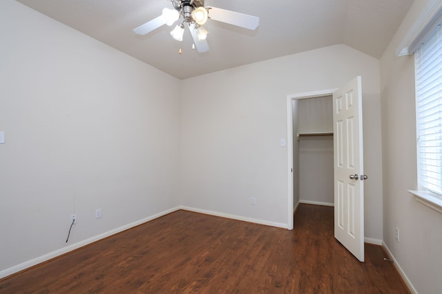 30515 Red Bluff Cir, Magnolia, TX 77355 - unfurnished bedroom featuring vaulted ceiling, wood finished floors, a walk in closet, and ceiling fan