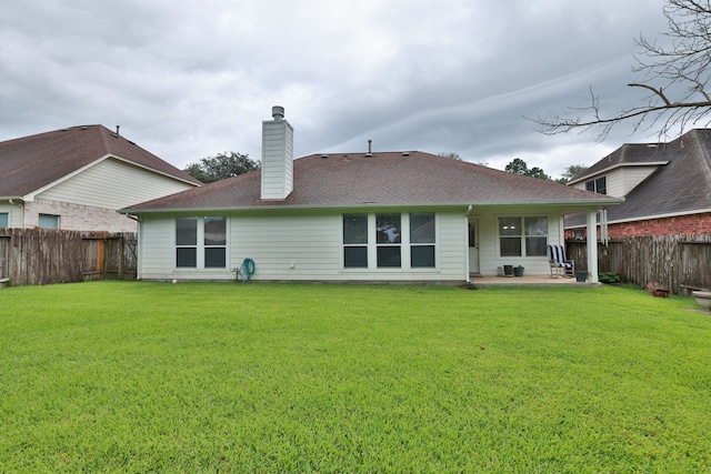 30515 Red Bluff Cir, Magnolia, TX 77355 - rear view of property featuring a patio, a fenced backyard, a chimney, and roof with shingles
