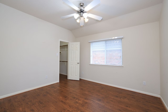 30515 Red Bluff Cir, Magnolia, TX 77355 - unfurnished bedroom with wood finished floors, a spacious closet, lofted ceiling, and ceiling fan