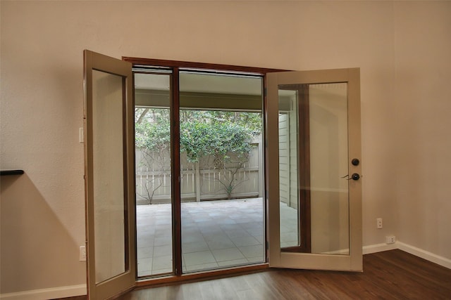 9400 Doliver Dr Unit 70, Houston, TX 77063 - doorway with wood finished floors and baseboards
