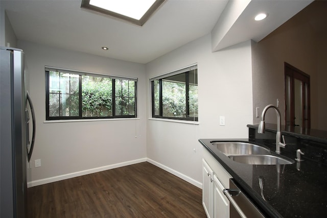 9400 Doliver Dr Unit 70, Houston, TX 77063 - kitchen featuring stainless steel appliances, dark stone countertops, white cabinetry, dark wood finished floors, and recessed lighting
