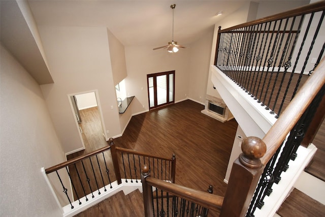 9400 Doliver Dr Unit 70, Houston, TX 77063 - stairway featuring ceiling fan, high vaulted ceiling, and wood finished floors