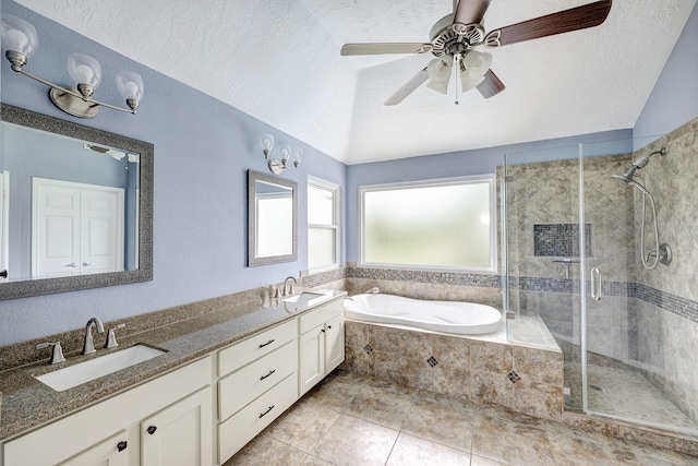 15434 Redbud Leaf Ln, Cypress, TX 77433 - full bath featuring lofted ceiling, a stall shower, a bath, double vanity, and a ceiling fan