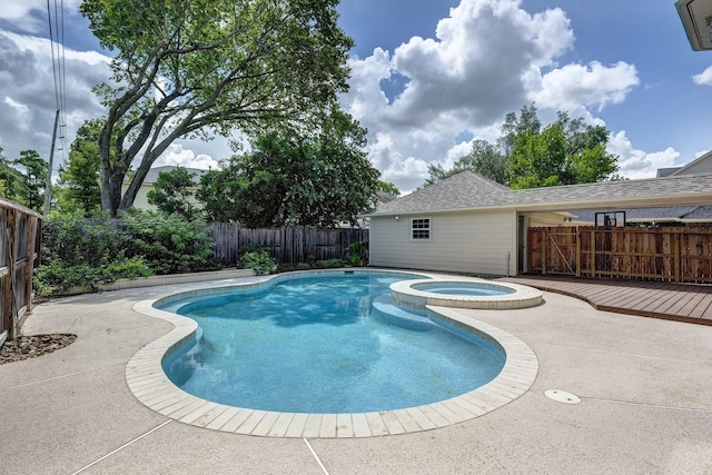 15434 Redbud Leaf Ln, Cypress, TX 77433 - view of pool with a fenced backyard, a pool with connected hot tub, and a patio area