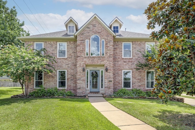 15434 Redbud Leaf Ln, Cypress, TX 77433 - view of front of house with a front lawn, brick siding, and a shingled roof
