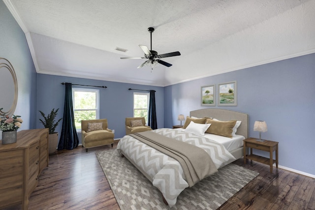 15434 Redbud Leaf Ln, Cypress, TX 77433 - bedroom with wood finished floors, vaulted ceiling, ceiling fan, a textured ceiling, and ornamental molding