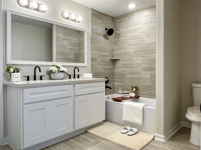 4817 Keeland St, Houston, TX 77016 - full bathroom with double vanity, wood finished floors, and  shower combination