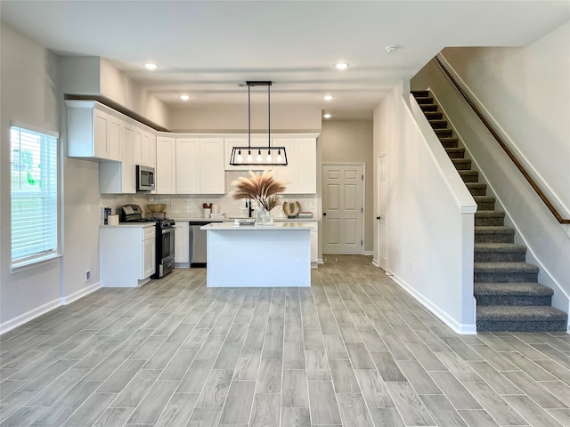 4817 Keeland St, Houston, TX 77016 - kitchen featuring stainless steel appliances, light countertops, light wood-style floors, and recessed lighting