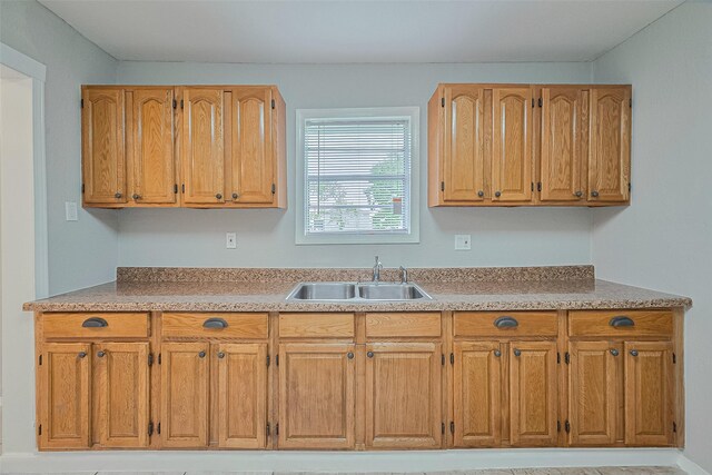 3024 Brackenridge St, Houston, TX 77026 - kitchen with light countertops and brown cabinets