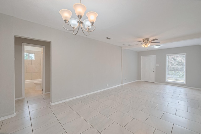 3024 Brackenridge St, Houston, TX 77026 - unfurnished room with light tile patterned flooring, a ceiling fan, and a chandelier