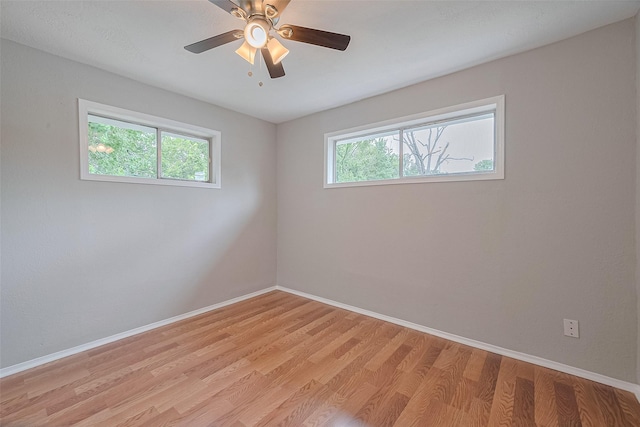3024 Brackenridge St, Houston, TX 77026 - spare room featuring light wood-style floors and a ceiling fan