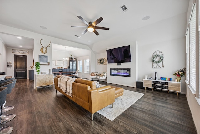 15603 Beltie Dr, Humble, TX 77346 - living area with dark wood finished floors, plenty of natural light, ceiling fan, and lofted ceiling