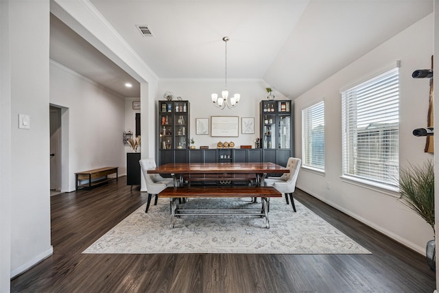15603 Beltie Dr, Humble, TX 77346 - dining area with a chandelier, dark wood-style floors, crown molding, and lofted ceiling