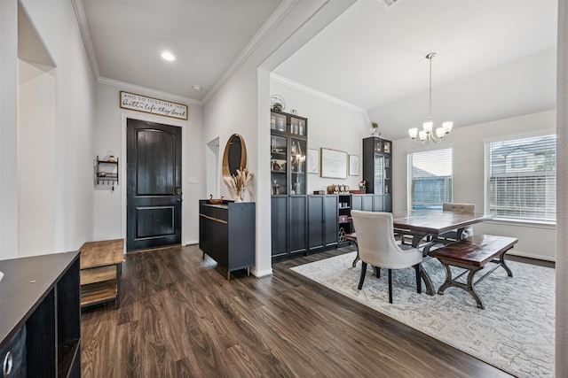 15603 Beltie Dr, Humble, TX 77346 - dining space with a chandelier, dark wood-type flooring, ornamental molding, and vaulted ceiling