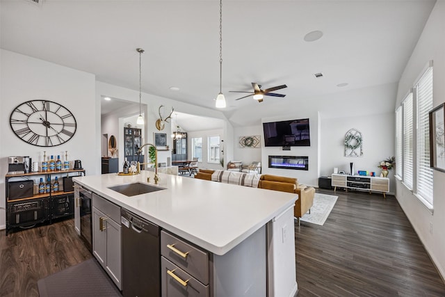 15603 Beltie Dr, Humble, TX 77346 - kitchen featuring dishwasher, light countertops, ceiling fan, dark wood-style flooring, and recessed lighting