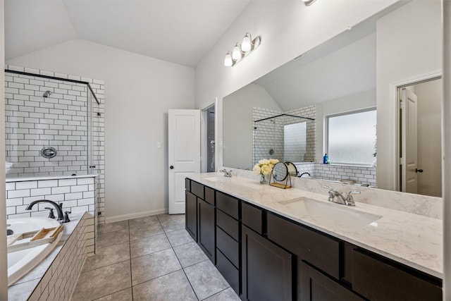 15603 Beltie Dr, Humble, TX 77346 - bathroom with vaulted ceiling, tiled shower, a bath, double vanity, and tile patterned flooring