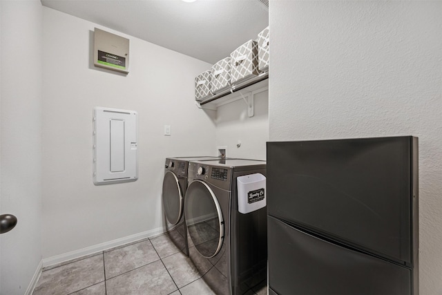 15603 Beltie Dr, Humble, TX 77346 - laundry area with separate washer and dryer, electric panel, and light tile patterned floors