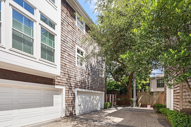 5220 Hazard St, Houston, TX 77098 - view of side of property featuring an attached garage and driveway