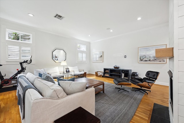 5220 Hazard St, Houston, TX 77098 - living area featuring ornamental molding, wood finished floors, and recessed lighting