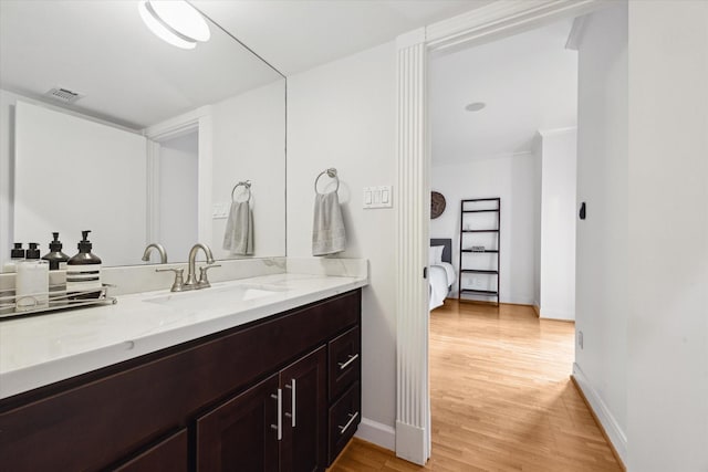 5220 Hazard St, Houston, TX 77098 - bathroom featuring vanity, wood finished floors, and ensuite bathroom