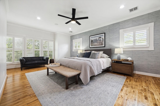 5220 Hazard St, Houston, TX 77098 - bedroom with wallpapered walls, wood finished floors, crown molding, recessed lighting, and ceiling fan
