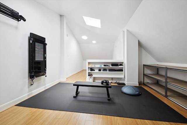 5220 Hazard St, Houston, TX 77098 - exercise area with a skylight, vaulted ceiling, and wood finished floors