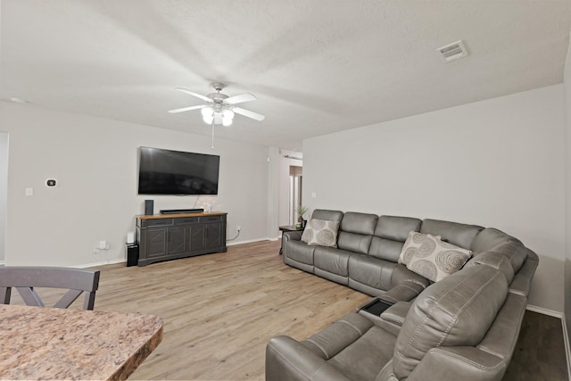 15010 Sunset Villa Ct, Humble, TX 77396 - living area featuring ceiling fan and light wood-style flooring