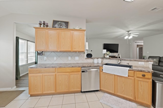 15010 Sunset Villa Ct, Humble, TX 77396 - kitchen with stainless steel dishwasher, light brown cabinetry, and open floor plan