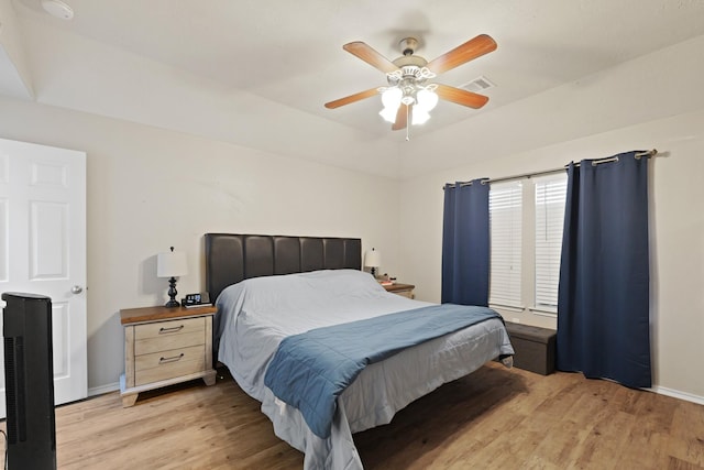 15010 Sunset Villa Ct, Humble, TX 77396 - bedroom with light wood-style flooring and a ceiling fan