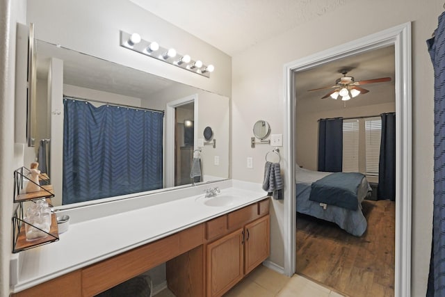 15010 Sunset Villa Ct, Humble, TX 77396 - bathroom featuring connected bathroom, a ceiling fan, vanity, and tile patterned floors
