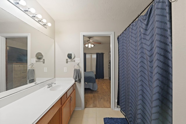 15010 Sunset Villa Ct, Humble, TX 77396 - full bath with tile patterned flooring, vanity, connected bathroom, a ceiling fan, and a shower with shower curtain