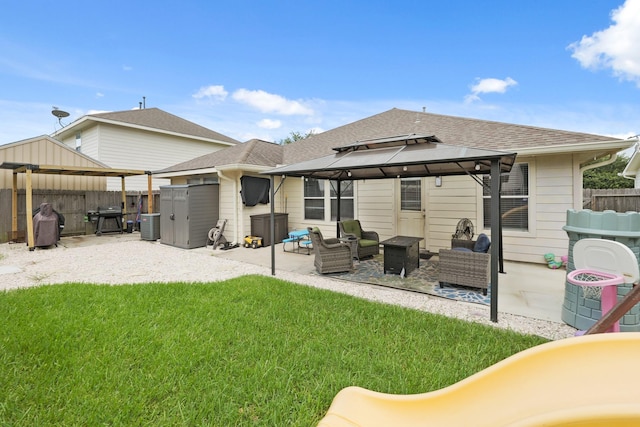 15010 Sunset Villa Ct, Humble, TX 77396 - back of house with a gazebo, an outdoor living space, a patio area, and roof with shingles