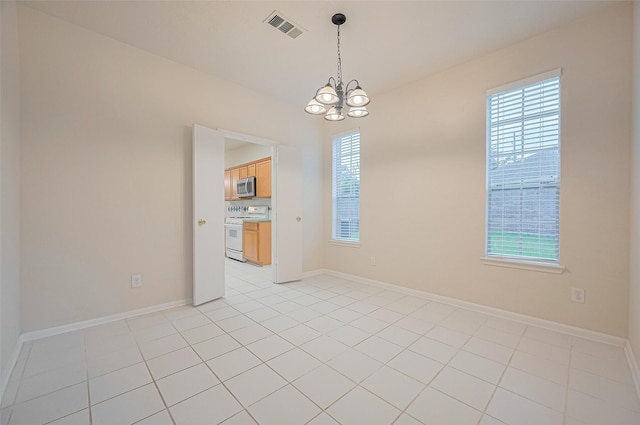 17134 Fairway Glen Ct, Sugar Land, TX 77498 - spare room featuring a chandelier, plenty of natural light, and light tile patterned flooring