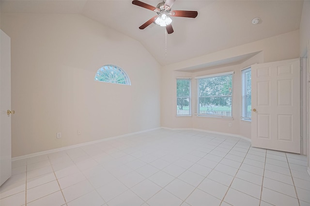 17134 Fairway Glen Ct, Sugar Land, TX 77498 - empty room featuring healthy amount of natural light, vaulted ceiling, light tile patterned floors, and a ceiling fan