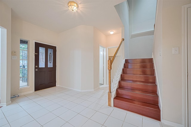 17134 Fairway Glen Ct, Sugar Land, TX 77498 - foyer entrance with stairway and light tile patterned floors
