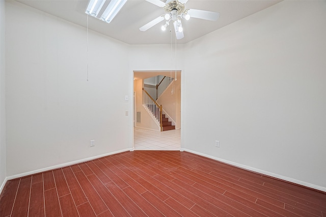 17134 Fairway Glen Ct, Sugar Land, TX 77498 - empty room featuring a ceiling fan, wood finished floors, and stairway