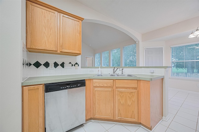 17134 Fairway Glen Ct, Sugar Land, TX 77498 - kitchen with stainless steel dishwasher, a peninsula, light tile patterned floors, backsplash, and vaulted ceiling