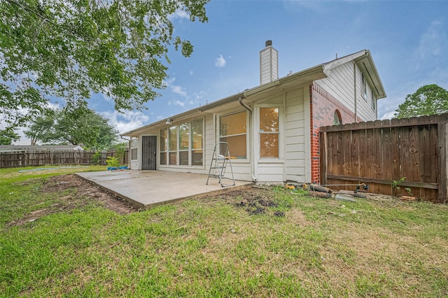 17134 Fairway Glen Ct, Sugar Land, TX 77498 - back of property featuring a patio area, a chimney, a fenced backyard, and brick siding