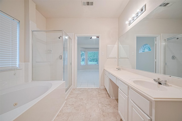 17134 Fairway Glen Ct, Sugar Land, TX 77498 - bathroom with double vanity, a garden tub, a shower stall, and tile patterned flooring