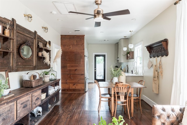 108 E 27th St, Houston, TX 77008 - dining area featuring a ceiling fan and dark wood-style flooring