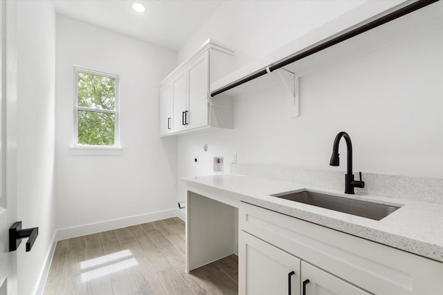 213 N 7th St, La Porte, TX 77571 - laundry area featuring cabinet space, hookup for a washing machine, light wood-style floors, recessed lighting, and hookup for an electric dryer