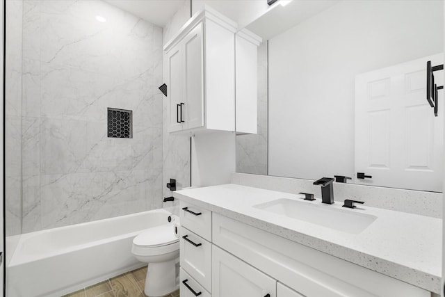 213 N 7th St, La Porte, TX 77571 - full bathroom with vanity, shower / bathtub combination, and wood finished floors