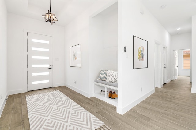 213 N 7th St, La Porte, TX 77571 - foyer featuring light wood finished floors and a chandelier