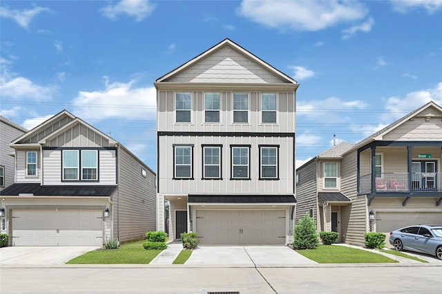 1909 Monaco Memorial Ln, Houston, TX 77043 - multi unit property with board and batten siding, a garage, and driveway