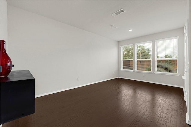 1909 Monaco Memorial Ln, Houston, TX 77043 - empty room with dark wood finished floors and recessed lighting