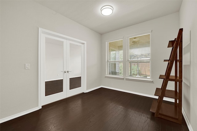1909 Monaco Memorial Ln, Houston, TX 77043 - unfurnished room featuring french doors and dark wood finished floors