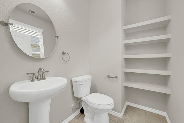 1909 Monaco Memorial Ln, Houston, TX 77043 - bathroom with toilet and tile patterned flooring