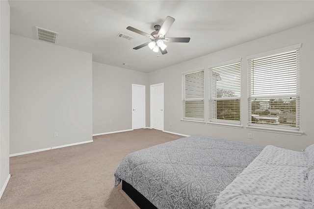 1909 Monaco Memorial Ln, Houston, TX 77043 - carpeted bedroom featuring baseboards and a ceiling fan