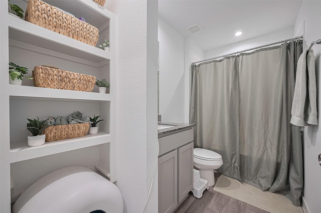 3918 Beltingham Bend Way, Fulshear, TX 77441 - bathroom featuring vanity, wood finished floors, a shower with shower curtain, and recessed lighting